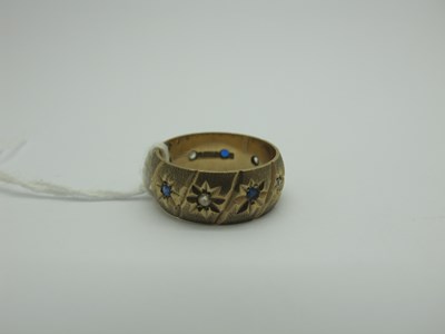 Lot 315 - A 9ct Gold Wedding Band, alternate star inset,...