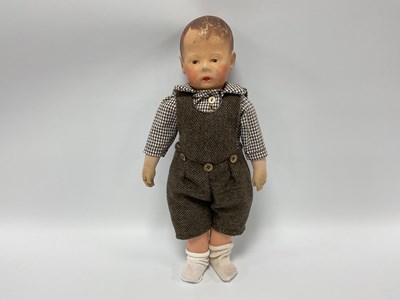 Lot 819 - A Kathe Kruse Doll, with painted head, painted...