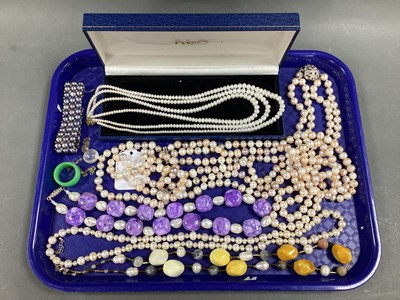 Lot 164 - A Modern Peach Fresh Water Pearl Bead Three...