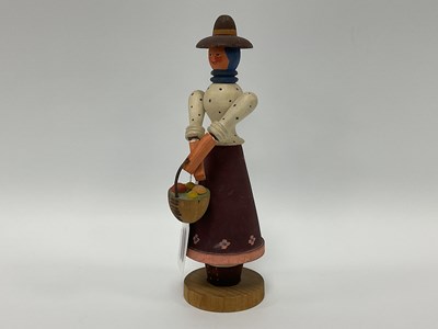 Lot 920 - A Wooden Folk Art Doll, marked to base made in...