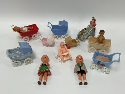 Lot 914 - A Collection of Plastic Toy Prams and Dolls by...