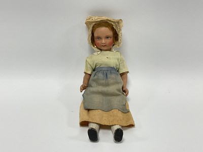 Lot 812 - A Small Bisque Headed Doll, with painted face,...