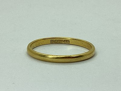 Lot 36 - A Plain Slim Wedding Band, stamped "22ct"...