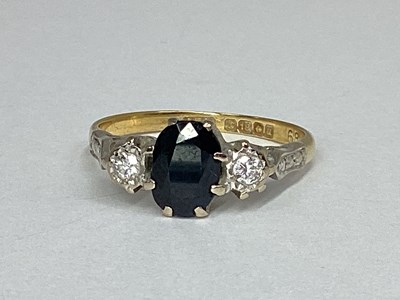 Lot 50 - An 18ct Gold Three Stone Ring, oval claw set...
