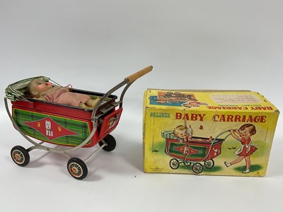 Lot 952 - A 1960s Tinplate Battery Powered Pram by 'T.N'...