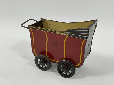 Lot 978 - 1930s Wells Tinplate Toy Pram, maroorn/black,...