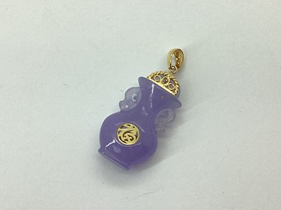 Lot 68 - A Lavender Jade Coloured Carved Vase Pendant,...