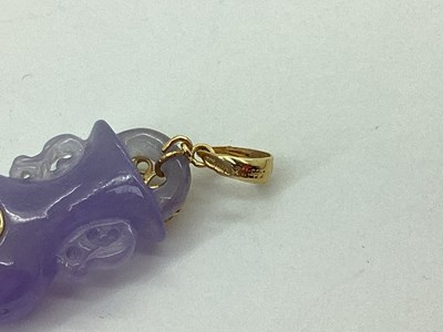 Lot 68 - A Lavender Jade Coloured Carved Vase Pendant,...