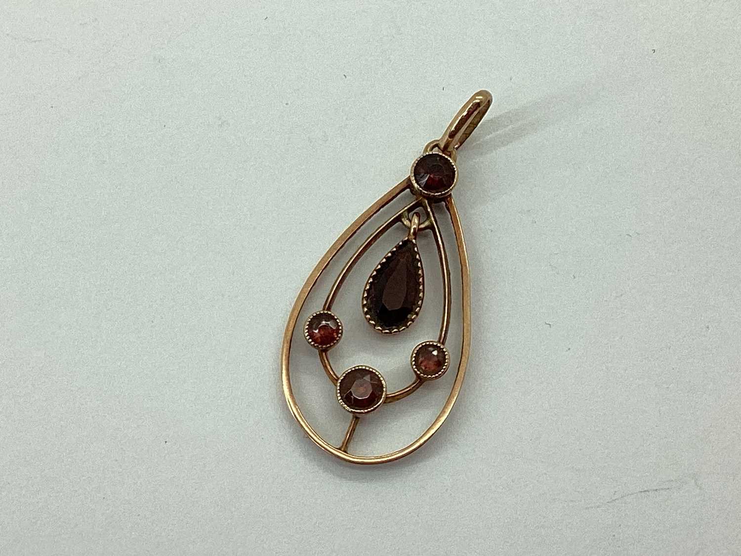 Lot 67 - An Edwardian Style Pendant, of teardrop...