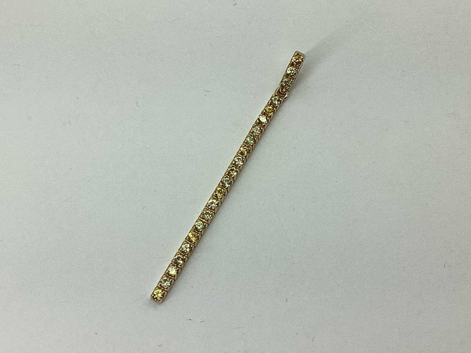 Lot 66 - A Modern Stone Set Elongated Drop Pendant, of...