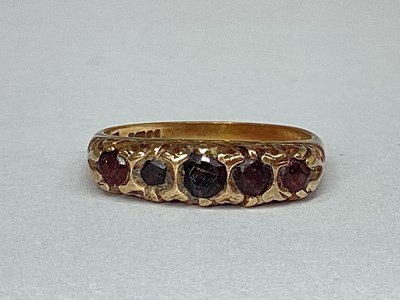 Lot 51 - A 9ct Gold Five Stone Dress Ring, inset within...