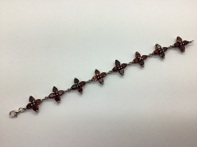 Lot 143 - A Modern Garnet Set Bracelet, of quatrefoil...