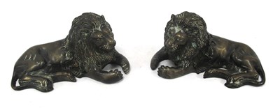 Lot 1442 - Pair of recumbent bronze lion sculptures with...