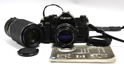 Lot 818 - Canon A-1 35mm SLR Film Camera, with attached...
