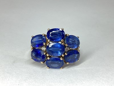 Lot 237 - A Modern Sapphire Seven Stone Dress Ring, oval...