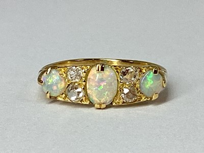 Lot 235 - An Antique Opal and Diamond Ring, oval and...