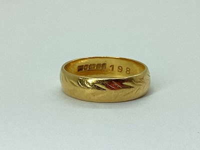 Lot 225 - A 22ct Gold Patterned Wedding Band, (finger...