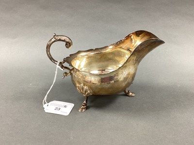 Lot 23 - An Edwardian Hallmarked Silver Sauce Boat,...
