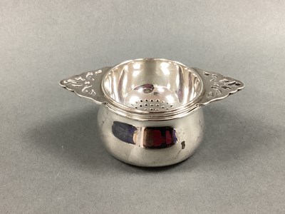 Lot 72 - A Matched Hallmarked Silver Tea Strainer on...