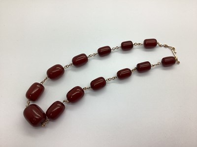 Lot 175 - A Cherry Amber Colour Wirework Bead Necklace,...