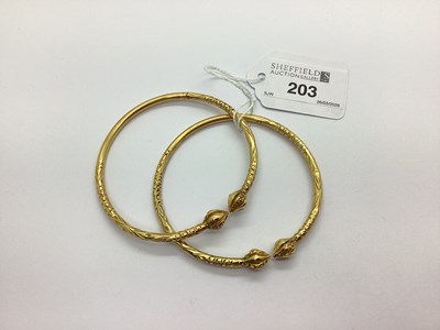 Lot 203 - A Pair of Taj Mahal Style Bangles, textured...