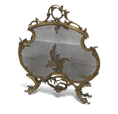 Lot 1327 - A Gilt Metal Rococo Style Fireguard, with mesh...