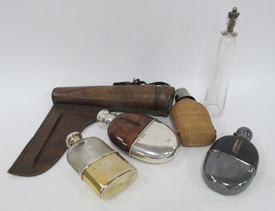 Lot 1303 - Vintage glass saddle flask with leather...