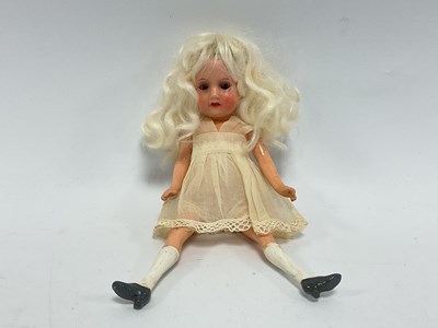 Lot 312 - A Small Bisque Headed German doll, with blue...