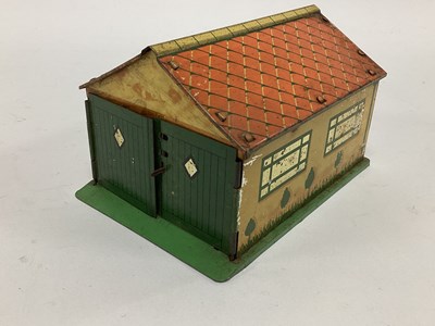 Lot 876 - A pre-war tinplate Dinky garage complete with...