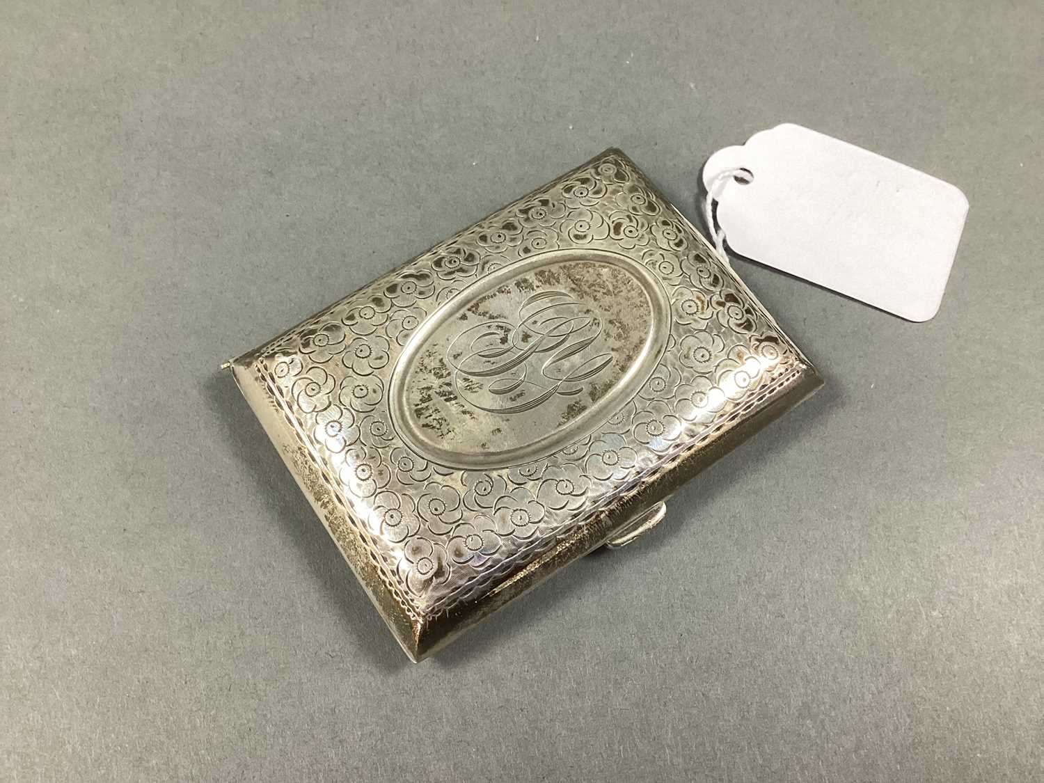 Lot 62 - A Hallmarked Silver Floral Patterned Cigarette...