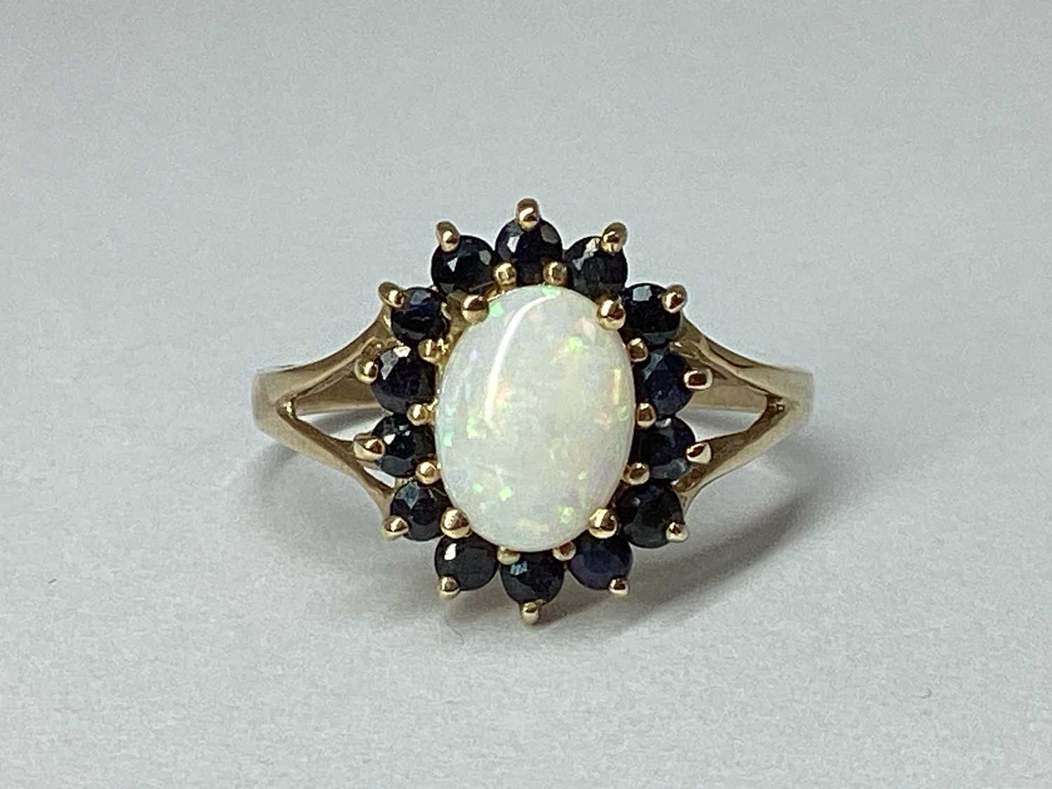 Lot 69 - A Modern 9ct Gold Cluster Ring, of flowerhead...