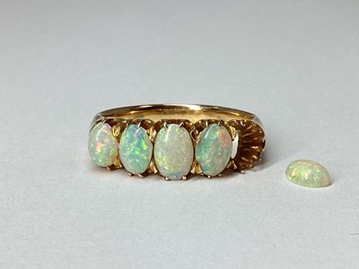 Lot 92 - A Five Stone Opal Ring, graduated claw set...