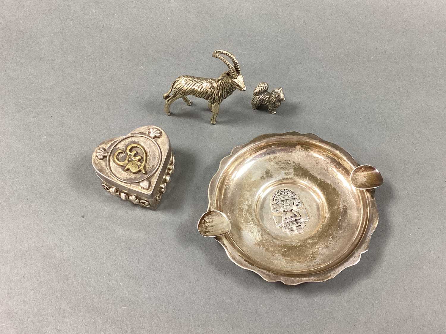 Lot 50 - A Miniature Circular Ashtray, depicting Tumi...