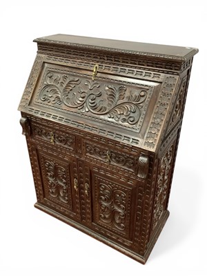Lot 1592 - A Heavy Carved Bureau, with a carved fall, two...