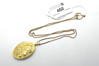 Lot 402 - An Oval Locket Pendant, foliate engraved to...