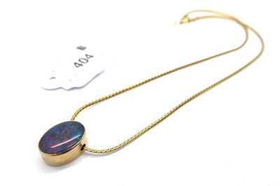 Lot 404 - A 9ct Gold Oval Black Opal Sliding Pendant,...