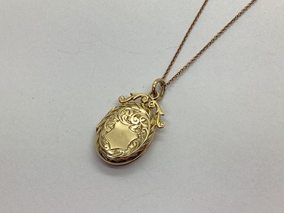 Lot 133 - A Decorative 9ct Gold Oval Locket, with scroll...