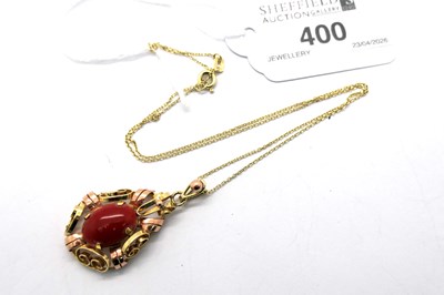 Lot 400 - A Coral Cabochon Inset Openwork Pendant, claw...