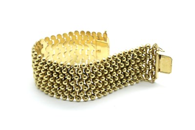 Lot 366 - A Wide Textured Bracelet, of uniform design to...