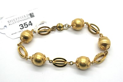Lot 354 - A Fancy Link Bead Bracelet, textured and...