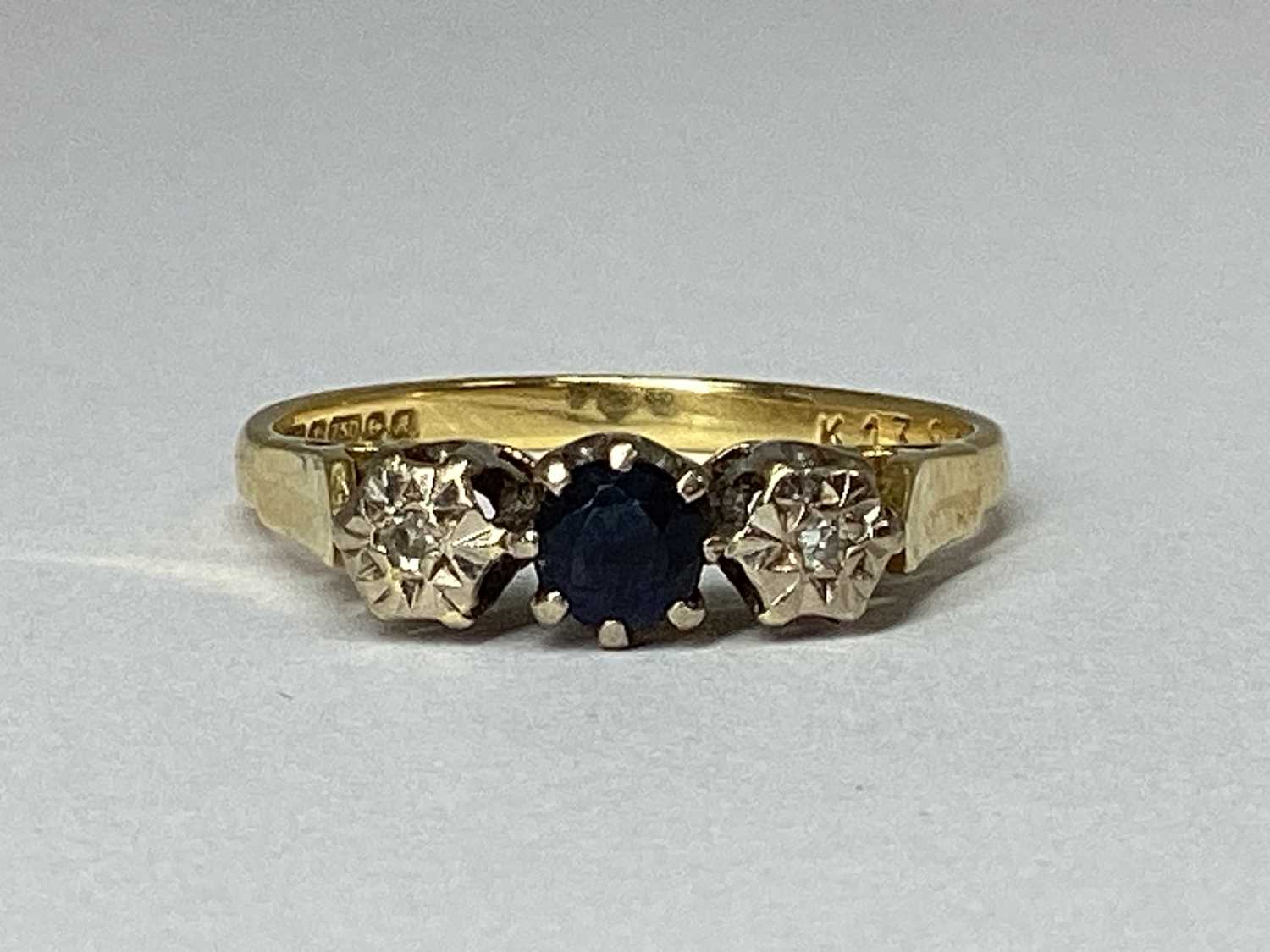 Lot 79 - An 18ct Gold Three Stone Ring, the centre...