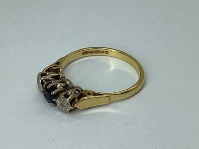 Lot 79 - An 18ct Gold Three Stone Ring, the centre...