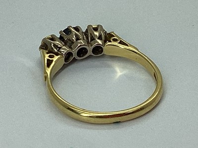 Lot 79 - An 18ct Gold Three Stone Ring, the centre...