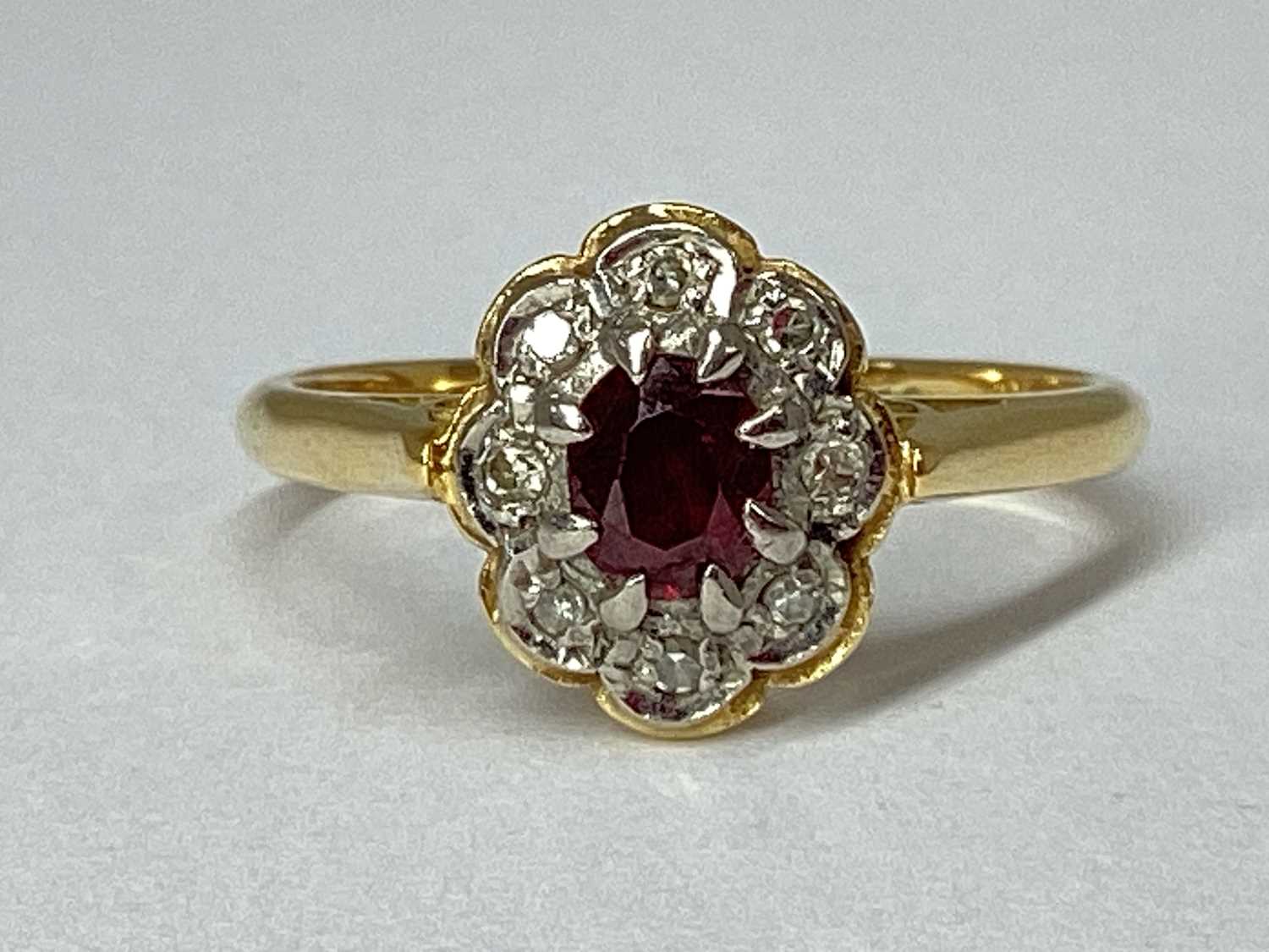 Lot 77 - An Oval Flowerhead Style Cluster Ring, the...