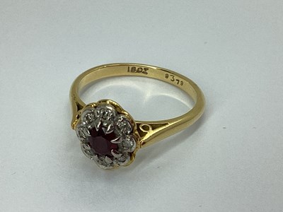 Lot 77 - An Oval Flowerhead Style Cluster Ring, the...