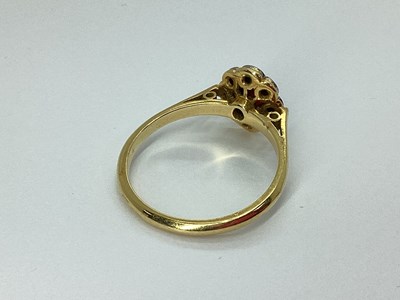 Lot 77 - An Oval Flowerhead Style Cluster Ring, the...