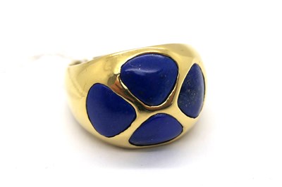 Lot 254 - A Lapis Lazuli Inset Dress Ring, bombé style...