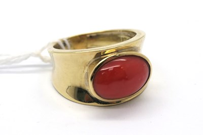 Lot 255 - A Coral Inset Dress Ring, oval cabochon collet...