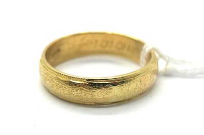Lot 260 - An 18ct Gold Wedding Band, textured finish...