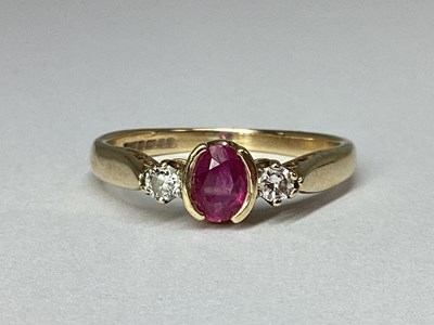 Lot 90 - A 9ct Gold Three Stone Ring, the oval half...
